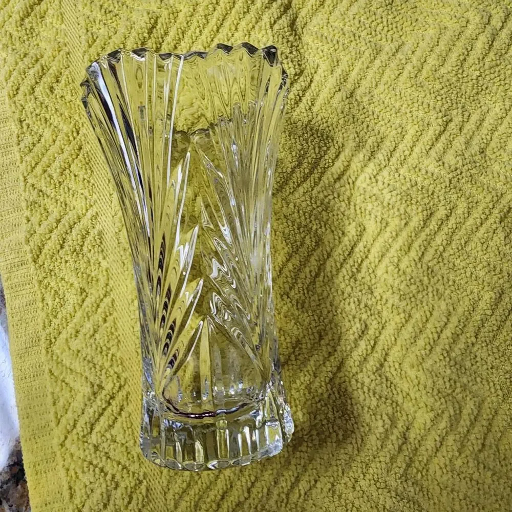 Clear heavy small glass vase approximately 4.75 inches tall